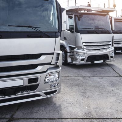 Group of trucks parked in a row.
